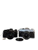 TWO 35MM FILM CAMERAS - OLYMPUS OM10 - CANON FTB