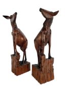 A PAIR OF 20TH CENTURY CARVED WOODEN FIGURE OF GOATS