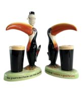 A PAIR OF 20TH CENTURY GUINNES TOUCAN FIGURES / LAMP BASE