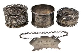 THREE HALLMARKED SILVER NAPKIN RINGS & A SILVER SHERRY BOTTLE TAG