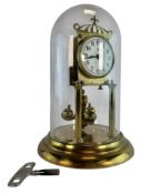 A 20TH CENTURY GLASS DOMED ANNIVERSARY CLOCK