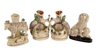A 19TH CENTURY COLLECTION OF STAFFORDSHIRE HAND PAINTED CERAMIC SPILL VASES AND FIGURES