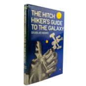 ADAMS, DOUGLAS - 1979 THE HITCH HIKER'S GUIDE TO THE GALAXY - FIRST EDITION