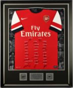 Arsenal FC - Squad signed 2013-14 season commemorative shirt, displayed alongside decorative