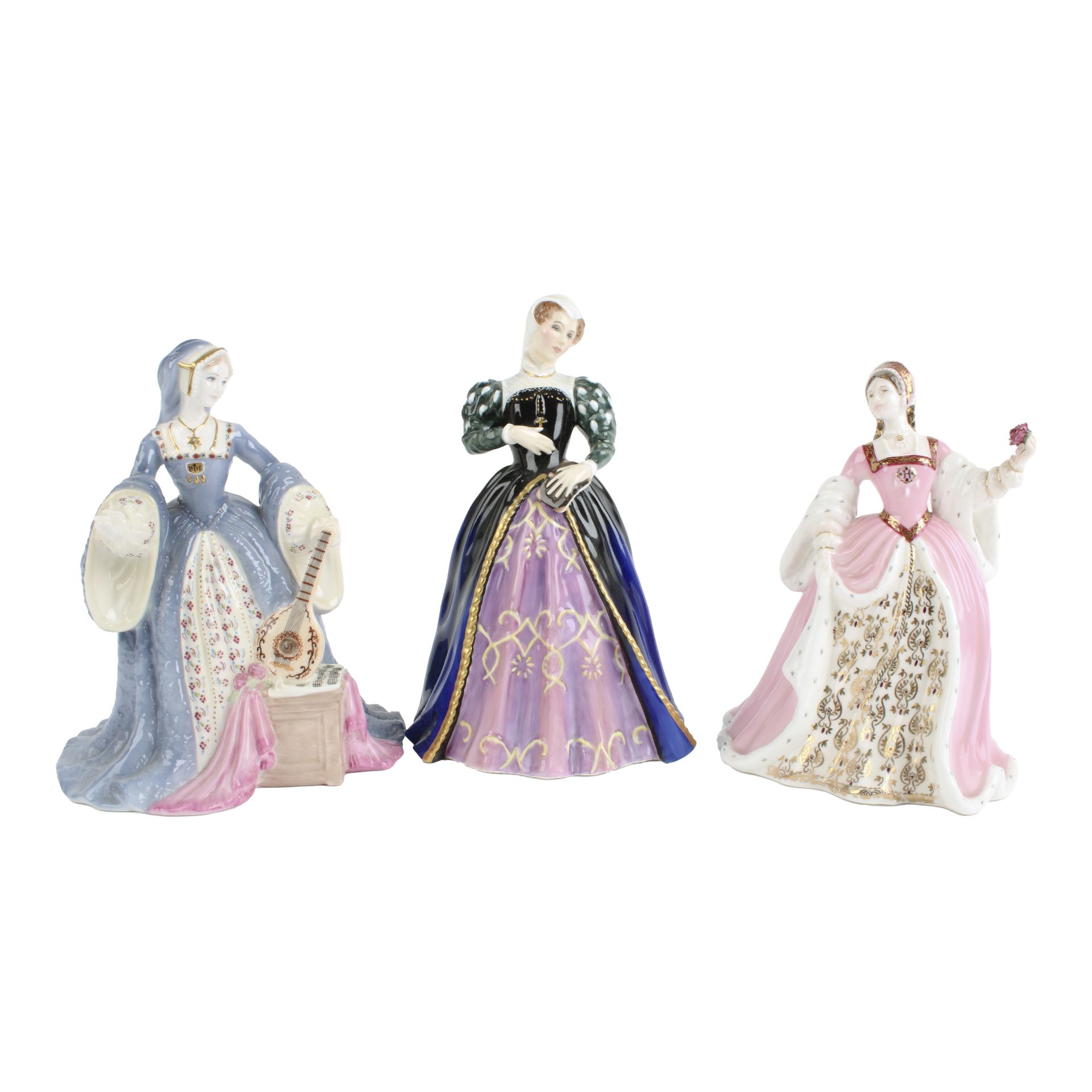 Three historical lady figurines
