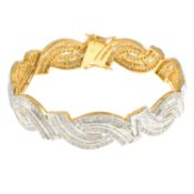 A vari-cut diamond hinged bangle