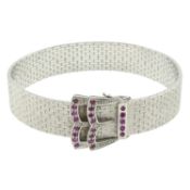 A mid 20th century textured 18ct gold and ruby buckle bracelet, by Pozzi Mario