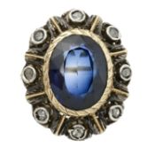 A synthetic sapphire and diamond point cluster ring