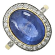 A buff top cabochon sapphire and diamond ring