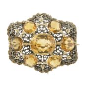A citrine pierced foliate bicolour brooch