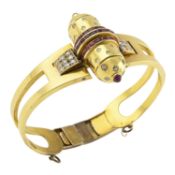 A 1940s gold, diamond and ruby hinged bangle