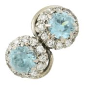 A mid 20th century 18ct gold blue zircon and diamond cluster crossover ring