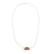 A 19th century seed pearl two-row necklace, with gold and carnelian clasp