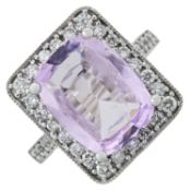 A pink sapphire and diamond ring