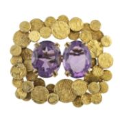 A mid 20th century 9ct gold and amethyst brooch