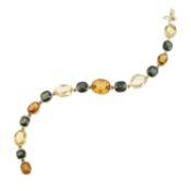 An alternating citrine and green sapphire collet bracelet