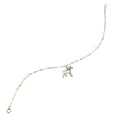 An Austrian Art Deco 14ct gold charm bracelet, suspending a diamond dog charm