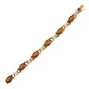 A citrine bracelet, with diamond stylised floral spacers