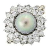 A mid 20th century gold, cultured pearl and diamond ring
