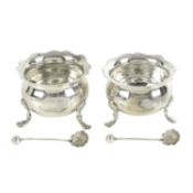 A matched pair of late Victorian silver open salts, with shell spoons