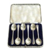 Golfing interest, a cased set of George V silver spoons