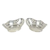 Matched pair of modern silver pierced dishes