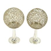 Stuart Devlin, a pair of parcel-gilt silver spherical candlesticks