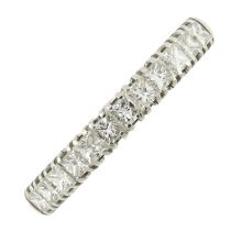 An 18ct gold diamond half eternity ring
