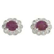 A pair of ruby & diamond cluster earrings