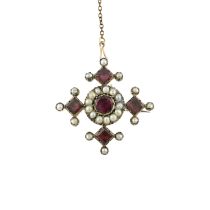 An early to mid 19th century foil-backed garnet & split pearl brooch