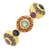 A glass-filled ruby, sapphire & emerald ring