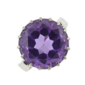 A synthetic colour-change sapphire single-stone ring