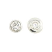 Two diamond stud earrings