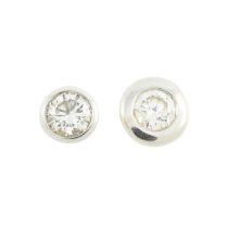 Two diamond stud earrings