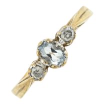 A topaz & diamond three-stone ring