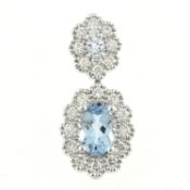 An 18ct gold aquamarine & diamond pendant