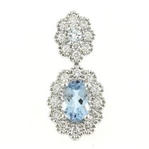 An 18ct gold aquamarine & diamond pendant