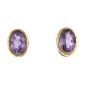 A pair of amethyst single-stone stud earrings