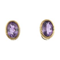 A pair of amethyst single-stone stud earrings