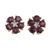 A pair of garnet & diamond floral earrings