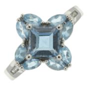 A topaz & diamond cluster ring