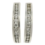 A pair of diamond hoop earrings