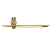 An owl bar brooch, with red gem eyes