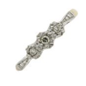 A mid 20th century diamond three-stone ring