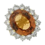 An 18ct gold, topaz and diamond cluster ring