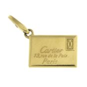 An 18ct gold 'C de Cartier', 13 Rue de la Paix, Paris letter charm, by Cartier