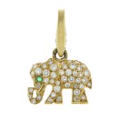 A pavé-set diamond elephant charm, with emerald eye, by Cartier
