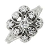 A diamond cluster dress ring