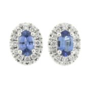 A pair of synthetic sapphire & diamond cluster stud earrings