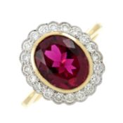 An 18ct gold purplish-red tourmaline & diamond cluster ring